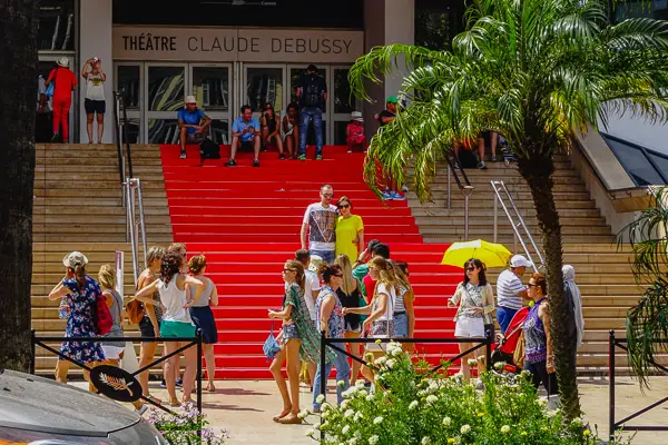 Tourists admire the red carpet in Cannes.