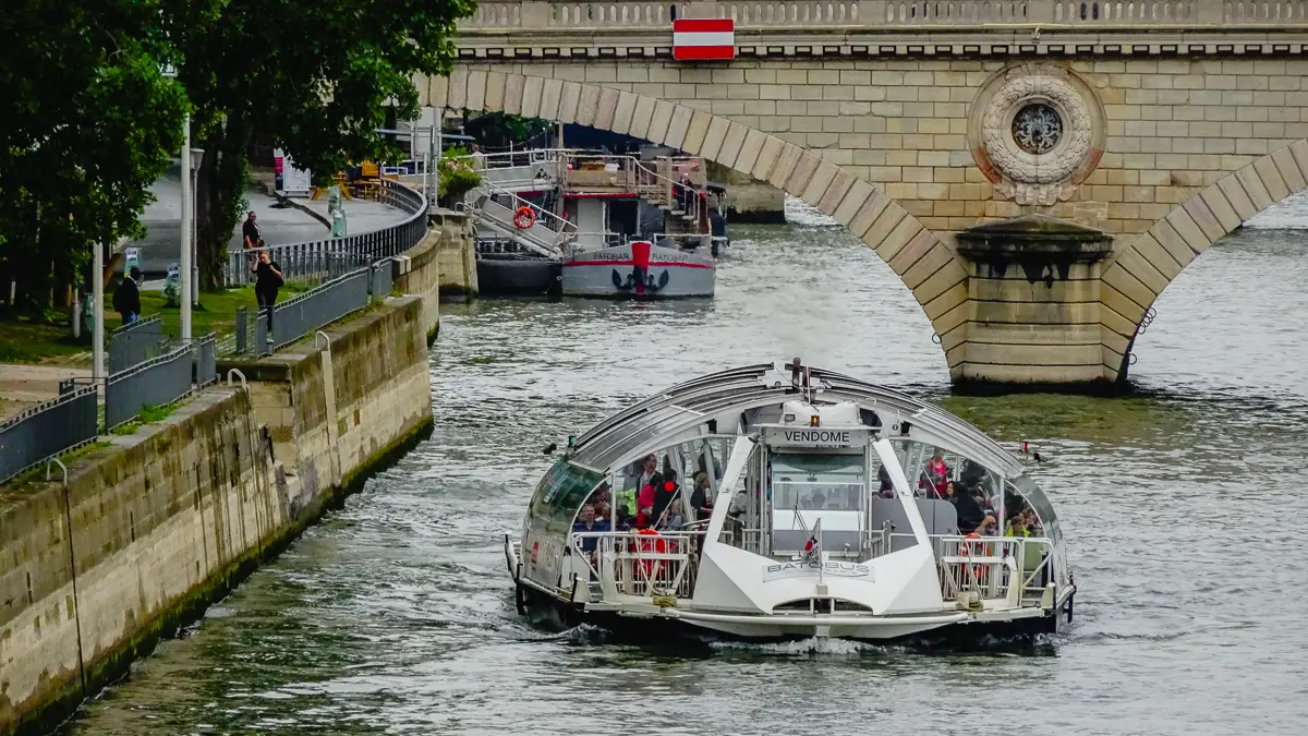 A Batobus travels on the Seine River in Paris, France.