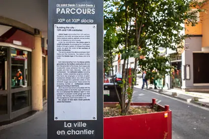 Historical marker and sign in Saint-Denis, France