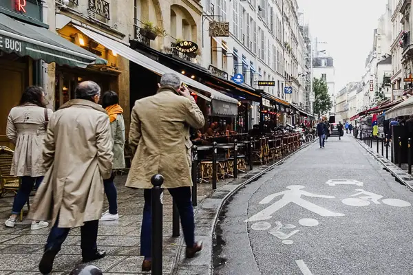 Beige coats in the Rue de Buci, Paris.
