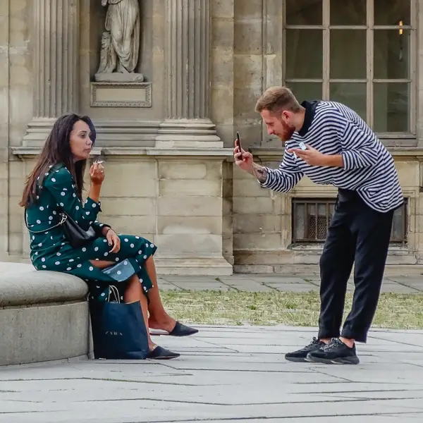Dots and stripes compete for attention as an amateur portrait artist focuses on his companion's cigarette.