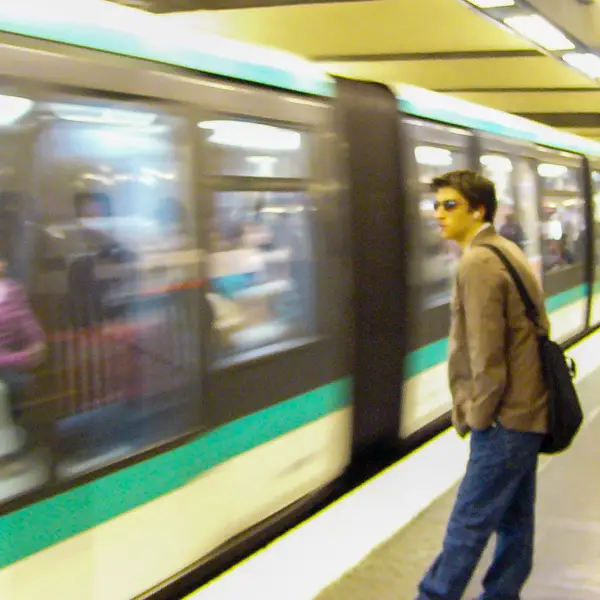 A Paris M�tro rider eyes an arriving train.