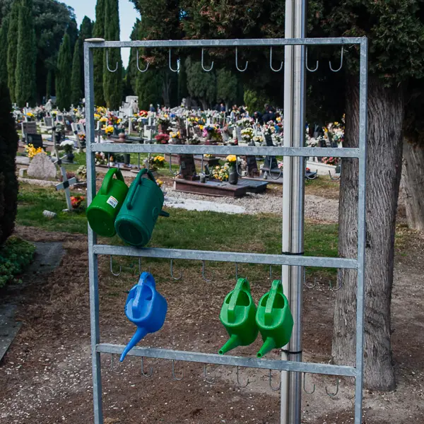 Watering cans at San Michele Cemetery in Venice, Italy.