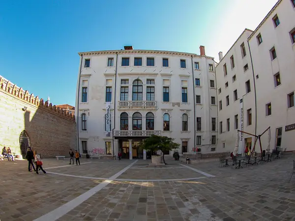 The palazzo's façade on the landward side is from the Renaissance--unlike the Grand Canal side of the building and the original courtyard wall  (left), which are from the Venetian Gothic period.