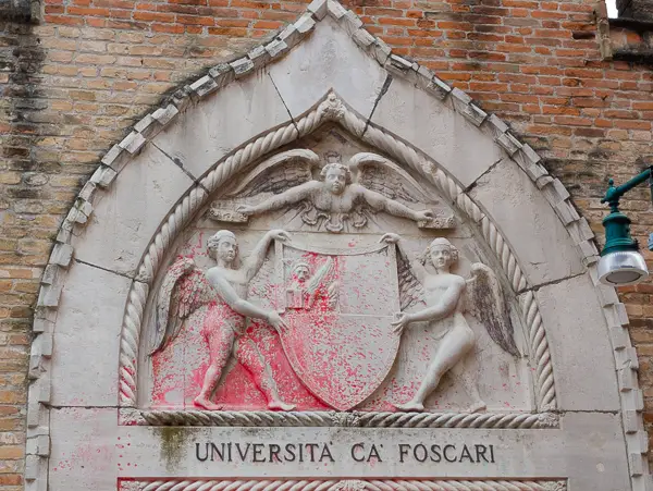 A stne bas-relief decorates the entrance to Ca' Foscari University in Venice, italy.
