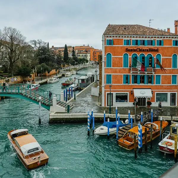 A water taxi cruises past the Hotel Santa Chiara on Venice's Piazzale Roma.