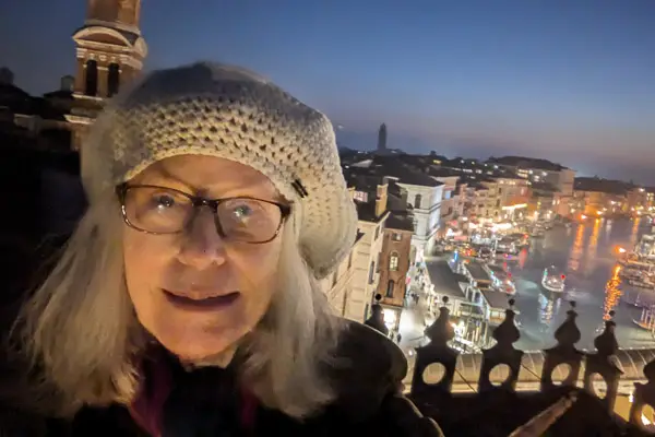 Cheryl Imboden selfie with Grand Canal from the Fondaco dei Tedeschi roof terrace in Venice, Italy.