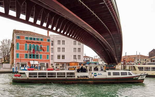 An ACTV motoscafo passes beneath the Calatrava Bridge on Venice's Grand Canal.
