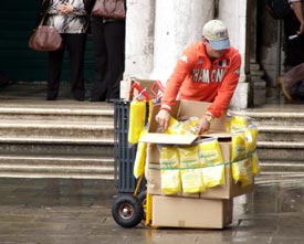 Acqua Alta plastic boots vendor in Piazza San Marco, Venice